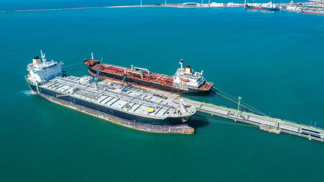 https://www.vecteezy.com/photo/7465946-aerial-top-view-of-fuel-tanker-ship-at-the-port-oil-terminal-is-industrial-facility-for-storage-of-oil-and-gas-petrochemical-products-ready-for-transport-to-further-storage-facilities