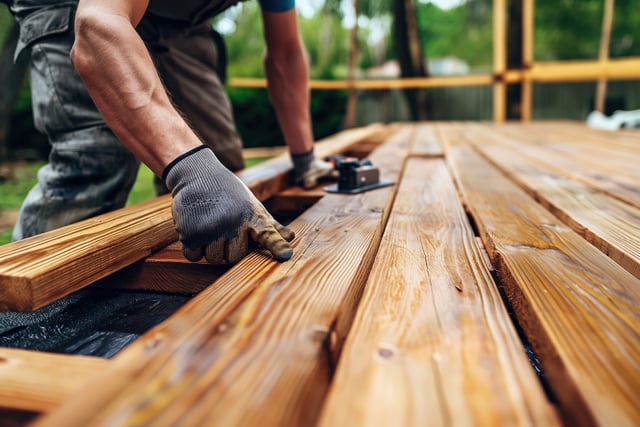 Carpenter installing wooden planks on terrace during renovation https://www.vecteezy.com/photo/70697329-carpenter-installing-wooden-planks-on-terrace-during-renovation