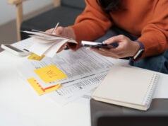 Who Doesn’t Have to File Taxes This Year? Details for Retirees, Students and Gig Workers https://www.vecteezy.com/photo/73228596-tax-management-individual-using-smartphone-while-organizing-tax-documents