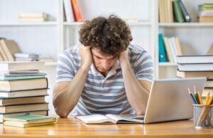 GMAT Preparation Online: How Digital Training Enhances Test Performance https://www.vecteezy.com/photo/49207865-the-student-looking-frustrated-or-stressed-with-a-messy-desk-filled-with-textbooks-notes-and-a-computer