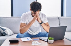 https://www.freepik.com/free-photo/young-hispanic-man-stressed-using-laptop-working-home_38414539.htm#fromView=search&page=1&position=23&uuid=e8b9ac08-d062-4354-ba9e-b92141c41bc2&query=financial+worries