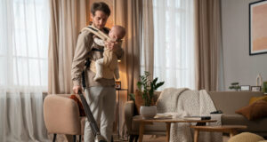 https://www.freepik.com/free-photo/full-shot-father-holding-baby-while-vacuuming_38050050.htm