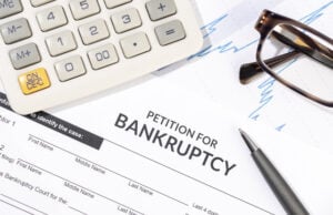 https://www.vecteezy.com/photo/21393817-bankruptcy-form-calculator-and-pen-on-desk-personal-injury-claim-form