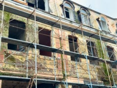 How Community Investment Unlocks Long-Term Economic Stability: Joe Mullins on Sustainable Growth https://www.vecteezy.com/photo/75776801-building-renovation-work-takes-place-on-an-old-structure-with-scaffolding-during-daylight-hours-in-a-city-environment