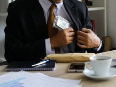 Embezzlement Defense: What You Should Know https://www.vecteezy.com/photo/7104539-corruption-and-bribery-businessman-receiving-money-on-his-office-desk