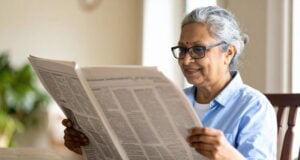 https://www.vecteezy.com/photo/69688740-senior-woman-with-gray-hair-and-glasses-reading-newspaper-indoors-smiling-and-enjoying-her-morning-in-cozy-home-setting-with-natural-light-and-plant-in-background