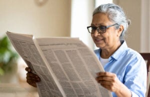https://www.vecteezy.com/photo/69688740-senior-woman-with-gray-hair-and-glasses-reading-newspaper-indoors-smiling-and-enjoying-her-morning-in-cozy-home-setting-with-natural-light-and-plant-in-background