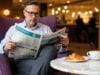 https://www.vecteezy.com/photo/72309554-sophisticated-man-reading-newspaper-in-armchair-with-coffee-and-croissant-at-cafe