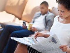 person reading newspaper