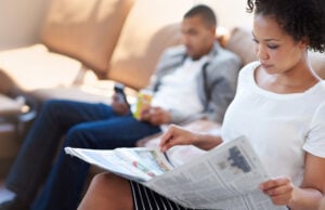person reading newspaper