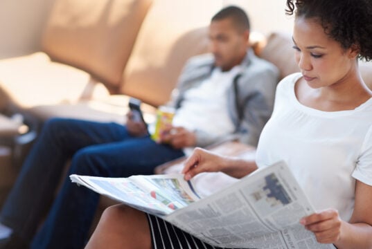 person reading newspaper