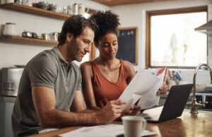 https://www.freepik.com/premium-photo/our-debt-is-almost-paid-off-cropped-shot-couple-using-their-laptop-going-through-paperwork-home_26983092.htm#from_element=cross_selling__photo