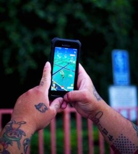 https://www.pexels.com/photo/a-person-playing-a-mobile-game-on-his-smartphone-5210981/
