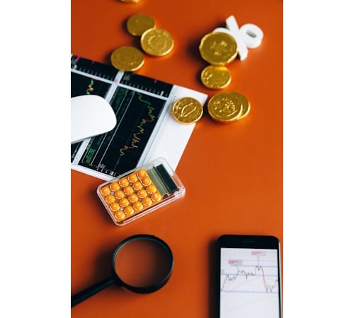 https://www.pexels.com/photo/orange-calculator-on-the-table-6120253/