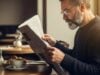 https://www.vecteezy.com/photo/74414231-a-man-reading-a-newspaper-in-a-cafe