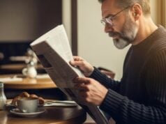 https://www.vecteezy.com/photo/74414231-a-man-reading-a-newspaper-in-a-cafe