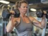 https://www.vecteezy.com/photo/53694764-a-muscular-woman-lifts-weights-in-a-gym-she-is-wearing-a-gray-tank-top-and-black-shorts-she-has-her-hair-in-a-ponytail-and-is-looking-at-the-weights-she-is-lifting
