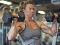 https://www.vecteezy.com/photo/53694764-a-muscular-woman-lifts-weights-in-a-gym-she-is-wearing-a-gray-tank-top-and-black-shorts-she-has-her-hair-in-a-ponytail-and-is-looking-at-the-weights-she-is-lifting