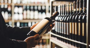 https://www.vecteezy.com/photo/73104289-faceless-person-holds-taking-from-shelf-bottle-of-wine-in-store-close-up