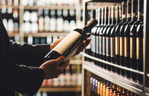 Quality Over Quantity: How to Make One Exceptional Bottle Last an Entire Week https://www.vecteezy.com/photo/73104289-faceless-person-holds-taking-from-shelf-bottle-of-wine-in-store-close-up