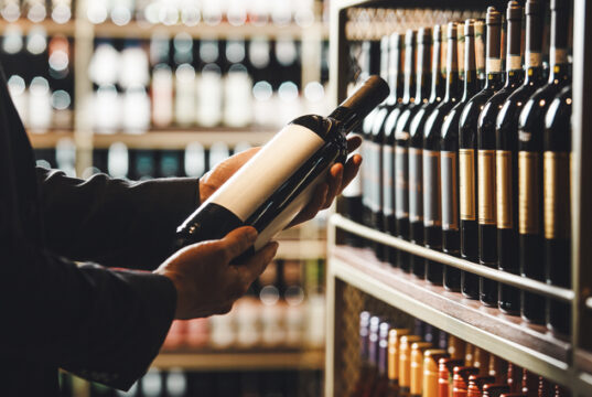 https://www.vecteezy.com/photo/73104289-faceless-person-holds-taking-from-shelf-bottle-of-wine-in-store-close-up