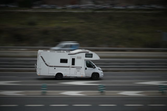 https://www.vecteezy.com/photo/55650509-passenger-car-white-on-the-highway-in-motion-with-a-blurred-background