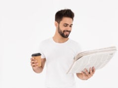 https://www.magnific.com/premium-photo/image-handsome-satisfied-man-drinking-coffee-takeaway-reading-newspaper-isolated-white-wall_17469799.htm#from_element=cross_selling__photo