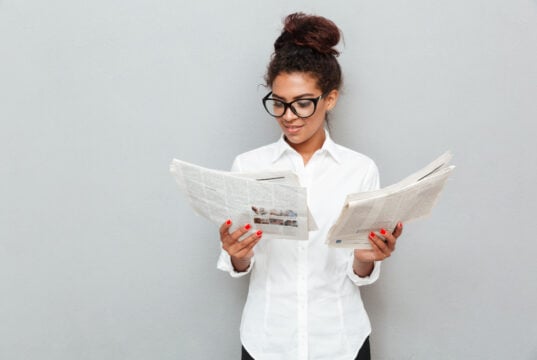 https://www.magnific.com/free-photo/cheerful-business-woman-standing-grey-wall-with-newspapers_7337953.htm#fromView=search&page=1&position=3&uuid=5e5534c7-bdaa-4fbb-804a-b26dc309b903&query=person+newspapers