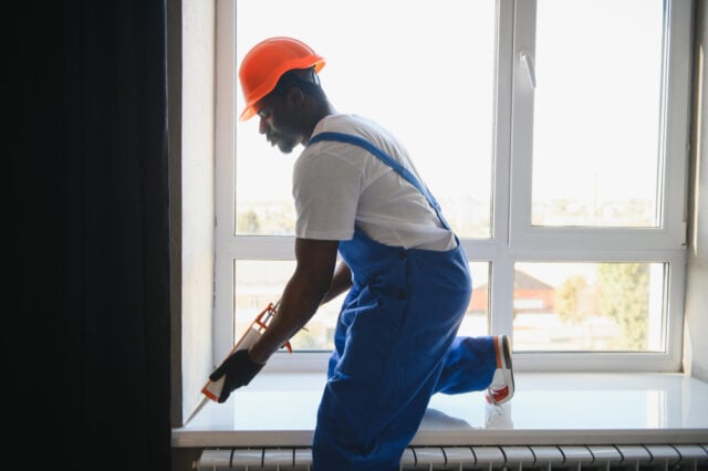 https://www.magnific.com/premium-photo/african-workman-overalls-installing-adjusting-plastic-windows-living-room-home_396463648.htm#from_element=cross_selling__photo