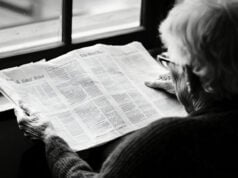 https://www.vecteezy.com/photo/60532938-an-elderly-woman-reading-the-newspaper