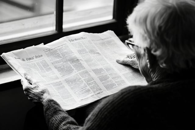 https://www.vecteezy.com/photo/60532938-an-elderly-woman-reading-the-newspaper