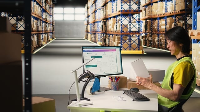 Asian depot worker processing orders and awb tracking numbers https://www.vecteezy.com/photo/79417509-asian-depot-employee-processing-orders-and-awb-monitoring-numbers-to-apply-on-boxes-for-the-delivery-process-registering-shipment-details-on-package-monitoring-software-fulfillment-center-camera-a