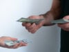 https://www.vecteezy.com/photo/73873674-close-up-of-transaction-with-dollar-bills-concept-of-debt-repayment-service-payment-or-money-lending