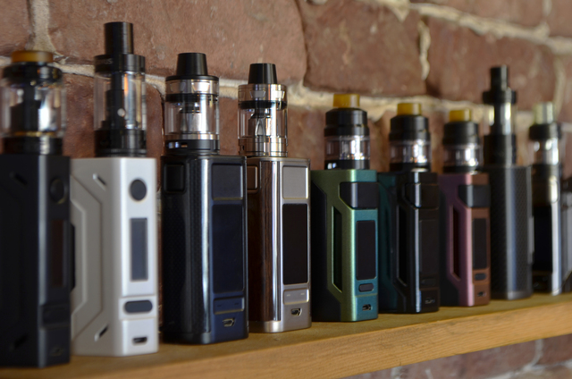 https://www.vecteezy.com/photo/12624326-electronic-cigarette-on-a-background-of-vape-shop-e-cigarette-for-vaping