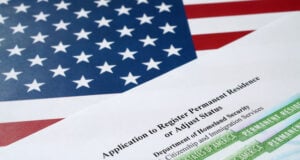 White House Upends Immigration System by Demanding Green Card Applicants File from Abroad https://www.vecteezy.com/photo/14002471-i-485-application-to-register-permanent-residence-or-adjust-status-form-and-green-card-from-dv-lottery-lies-on-united-states-flag-from-department-of-homeland-security