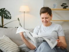 https://www.vecteezy.com/photo/39340485-middle-aged-woman-sitting-sofa-and-reading-newspapers
