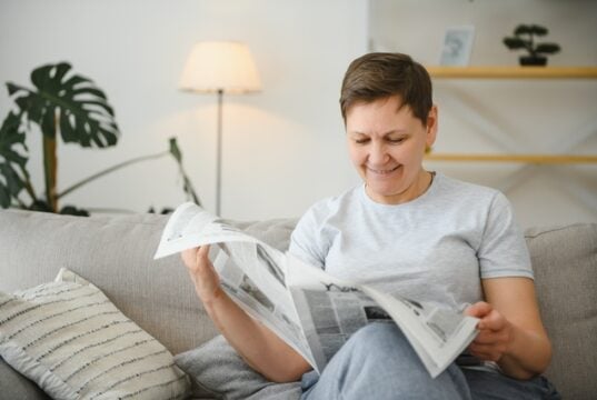 https://www.vecteezy.com/photo/39340485-middle-aged-woman-sitting-sofa-and-reading-newspapers