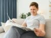 https://www.vecteezy.com/photo/39353486-middle-aged-woman-sitting-sofa-and-reading-newspapers