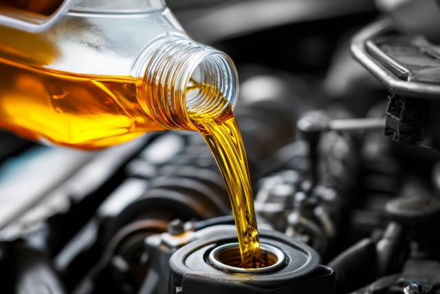 https://www.vecteezy.com/photo/71121914-pouring-fresh-golden-motor-oil-into-a-car-engine-oil-filler-cap-for-maintenance-and-lubrication-in-automotive-repair-and-service-setting