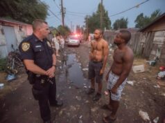 https://www.vecteezy.com/photo/71101813-three-men-standing-in-a-dirt-road-with-a-police-officer