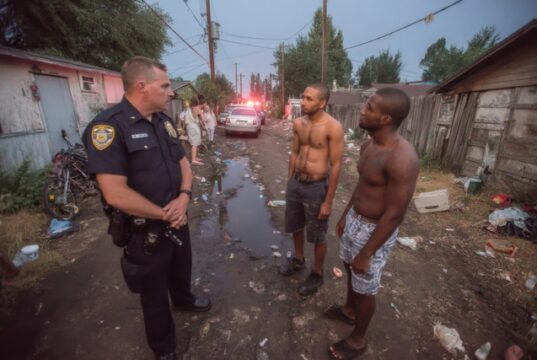 https://www.vecteezy.com/photo/71101813-three-men-standing-in-a-dirt-road-with-a-police-officer