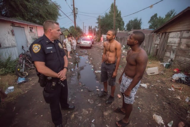 small-vecteezy_three-men-standing-in-a-dirt-road-with-a-police-officer_71101813_small https://www.vecteezy.com/photo/71101813-three-men-standing-in-a-dirt-road-with-a-police-officer
