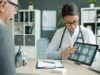 https://unsplash.com/photos/doctor-shows-patient-brain-scans-on-tablet-X_tBkG0U9yM