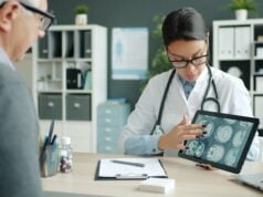 https://unsplash.com/photos/doctor-shows-patient-brain-scans-on-tablet-X_tBkG0U9yM
