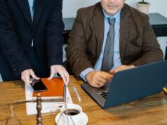 How a Florida Locked-In Syndrome Lawyer Helps Families Afford Lifetime Care https://www.pexels.com/photo/crop-colleagues-gathering-at-table-with-laptop-in-office-5668796/