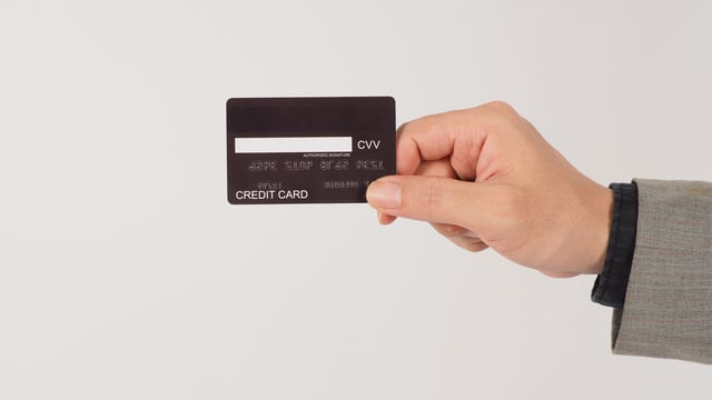 https://www.vecteezy.com/photo/14215212-a-hand-is-holding-back-of-black-credit-cards-and-wearing-a-suit-on-white-background