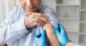 Redefining Seasonal Immunity: FDA Advisory Panel Recommends First mRNA Influenza Vaccine https://www.vecteezy.com/photo/74395127-closeup-of-senior-male-patient-with-adhesive-bandage-on-arm-after-vaccination