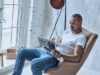 https://www.vecteezy.com/photo/13521993-resting-at-home-handsome-young-african-man-reading-newspaper-and-holding-a-cup-while-sitting-in-the-armchair-at-home