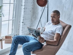 https://www.vecteezy.com/photo/13521993-resting-at-home-handsome-young-african-man-reading-newspaper-and-holding-a-cup-while-sitting-in-the-armchair-at-home