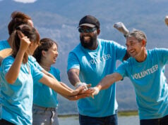https://www.vecteezy.com/photo/40572255-team-of-young-and-diversity-volunteer-worker-group-enjoy-charitable-social-work-outdoor-together-to-saving-environment-project-wearing-blue-t-shirt-while-joining-hand-in-power-assemble-unity